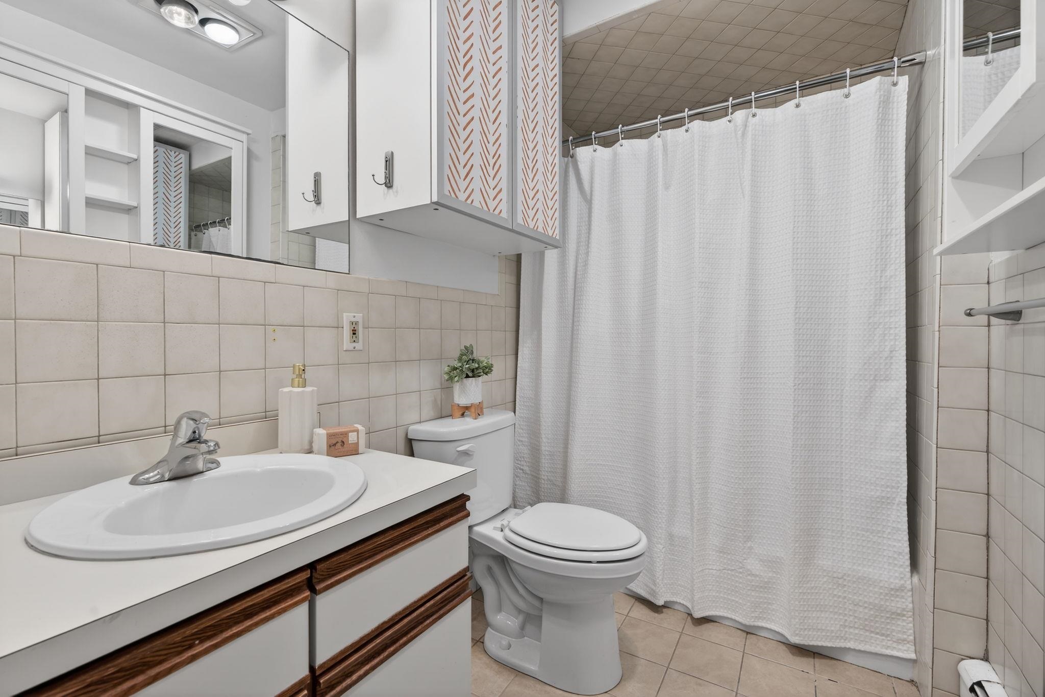 723 Washington Street, Unit 5 Hoboken, NJ 07030 - Photo 18 of 25 a bathroom with a sink toilet and shower