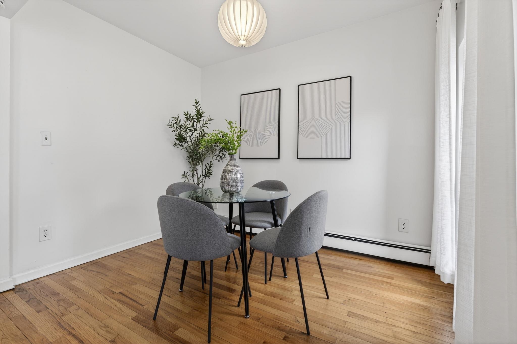 723 Washington Street, Unit 5 Hoboken, NJ 07030 - Photo 6 of 25 a view of a dining room with furniture and wooden floor