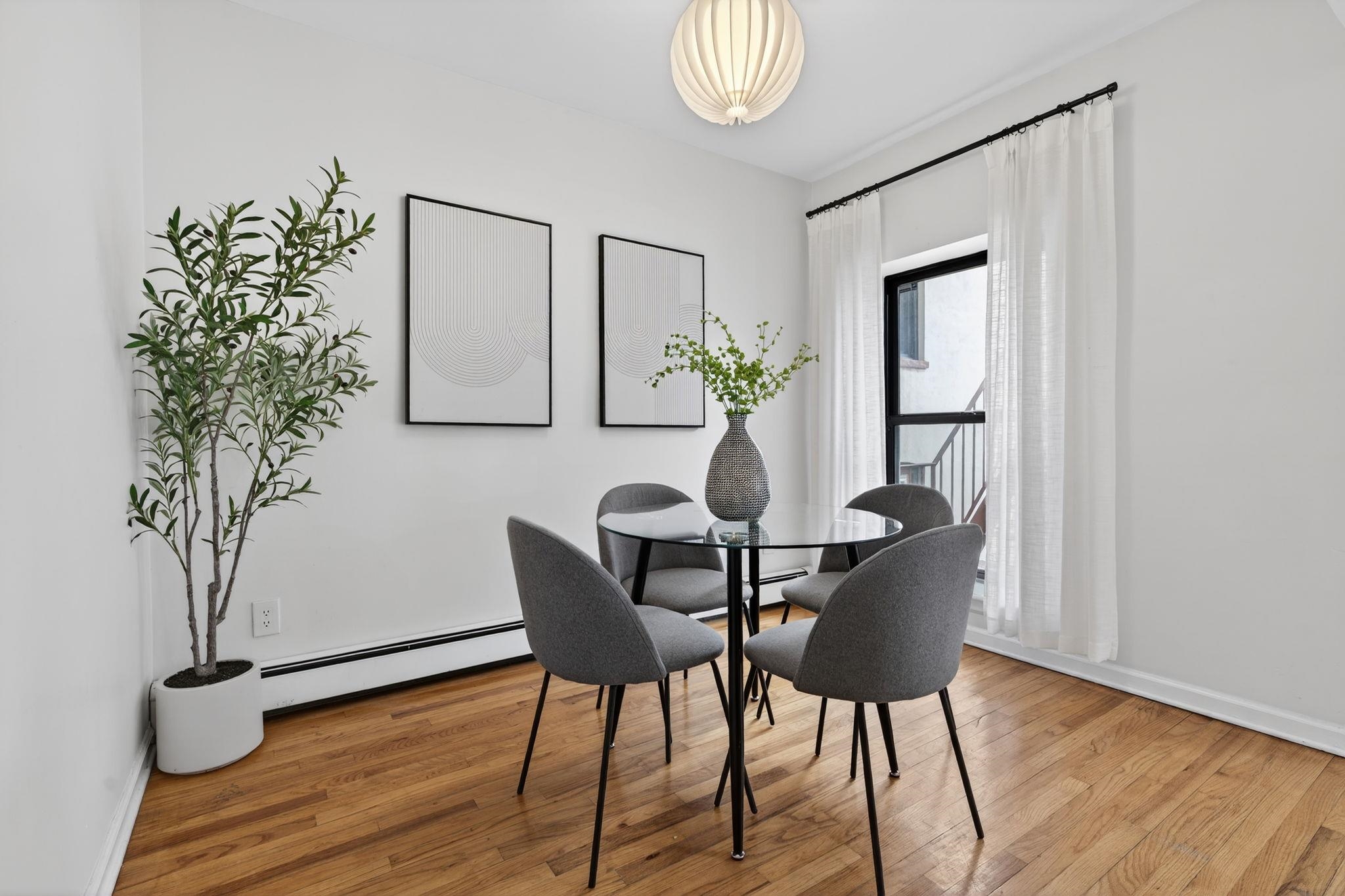723 Washington Street, Unit 5 Hoboken, NJ 07030 - Photo 7 of 25 a view of a dining room with furniture and wooden floor