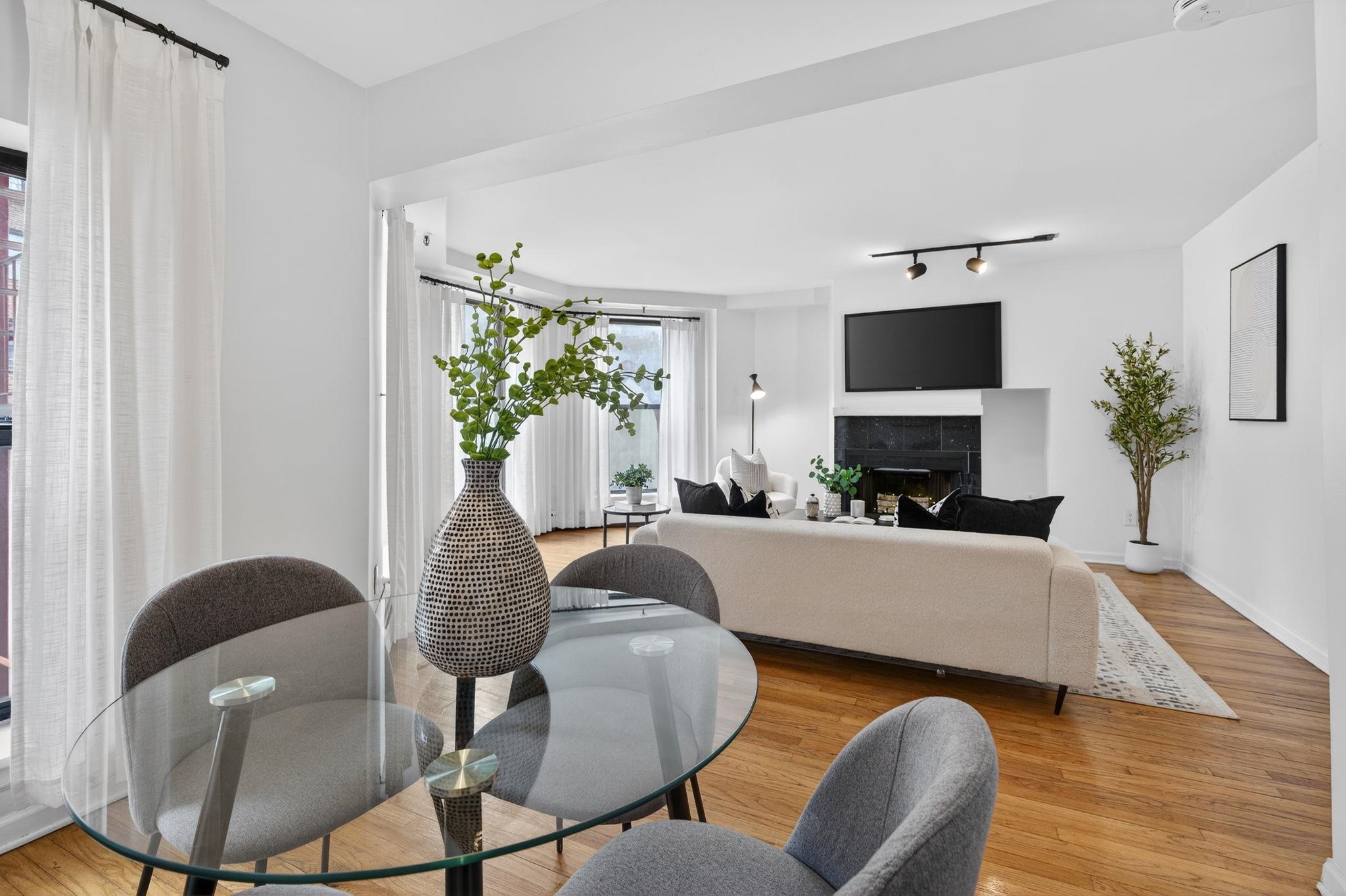 723 Washington Street, Unit 5 Hoboken, NJ 07030 - Photo 8 of 25 a living room with furniture a fireplace and a potted plant