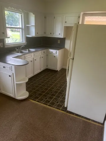 a kitchen with a sink and cabinets
