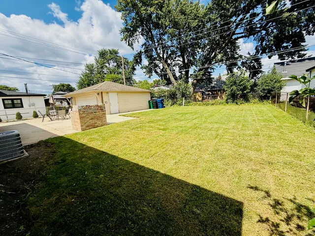 a view of a yard with an outdoor space