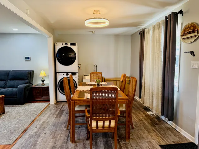 a dining room with furniture and window