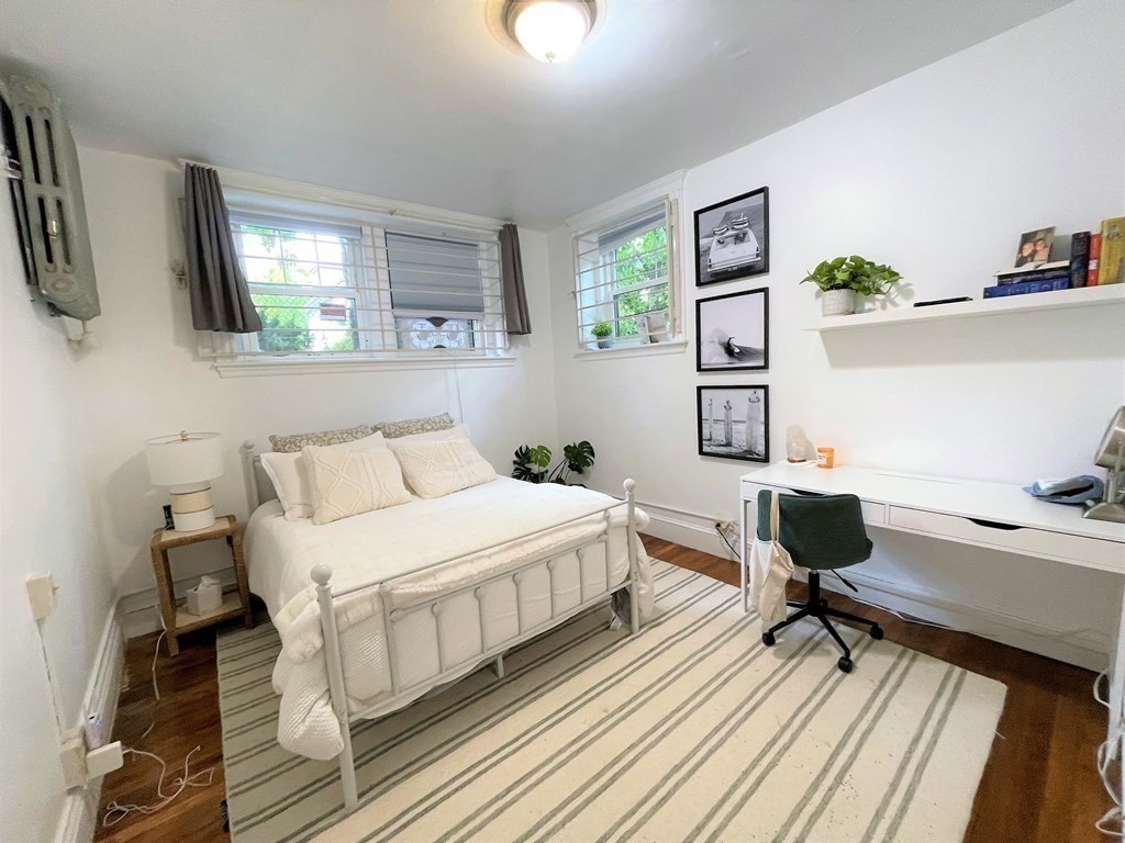33 Winslow Road, Unit B Brookline, MA 02446 - Photo 4 of 14 a bedroom with a bed and a window