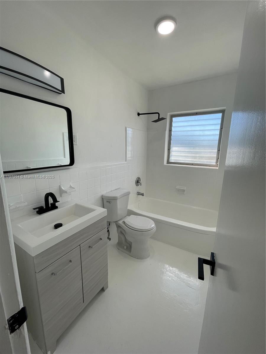 Surfside Surfside, FL 33154 - Photo 5 of 8 a bathroom with a toilet sink and mirror