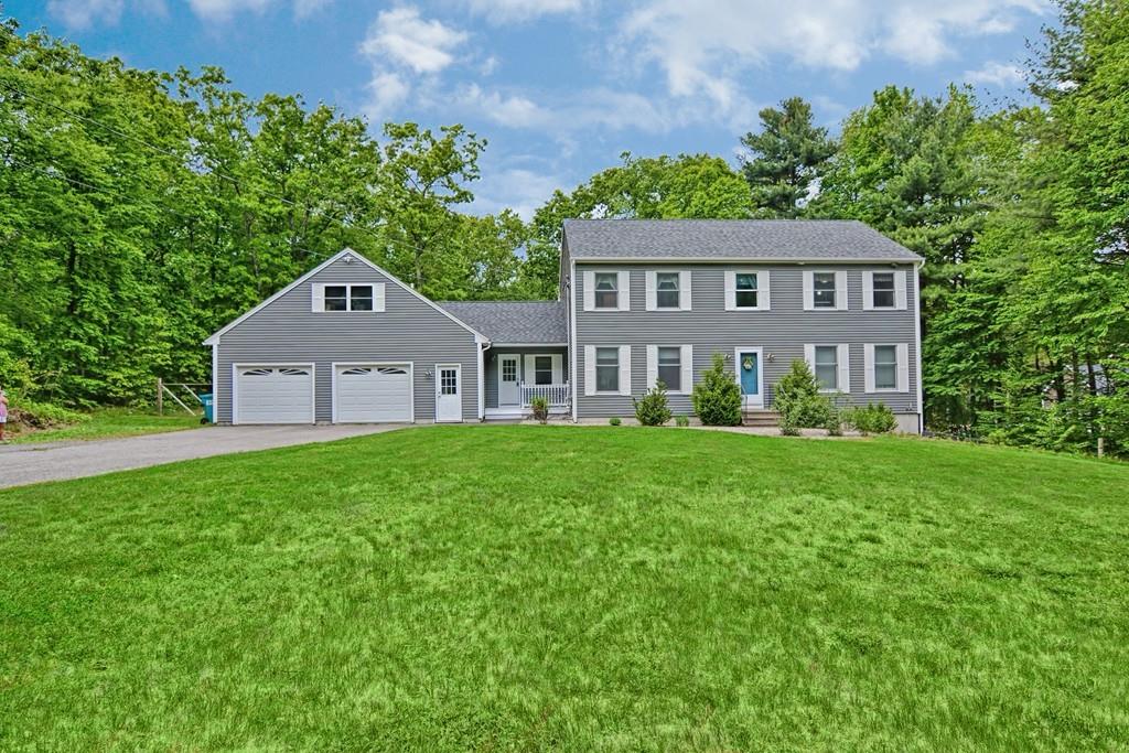 173 Webster Street Douglas, MA 01516 - Photo 1 of 42 a front view of a house with a yard