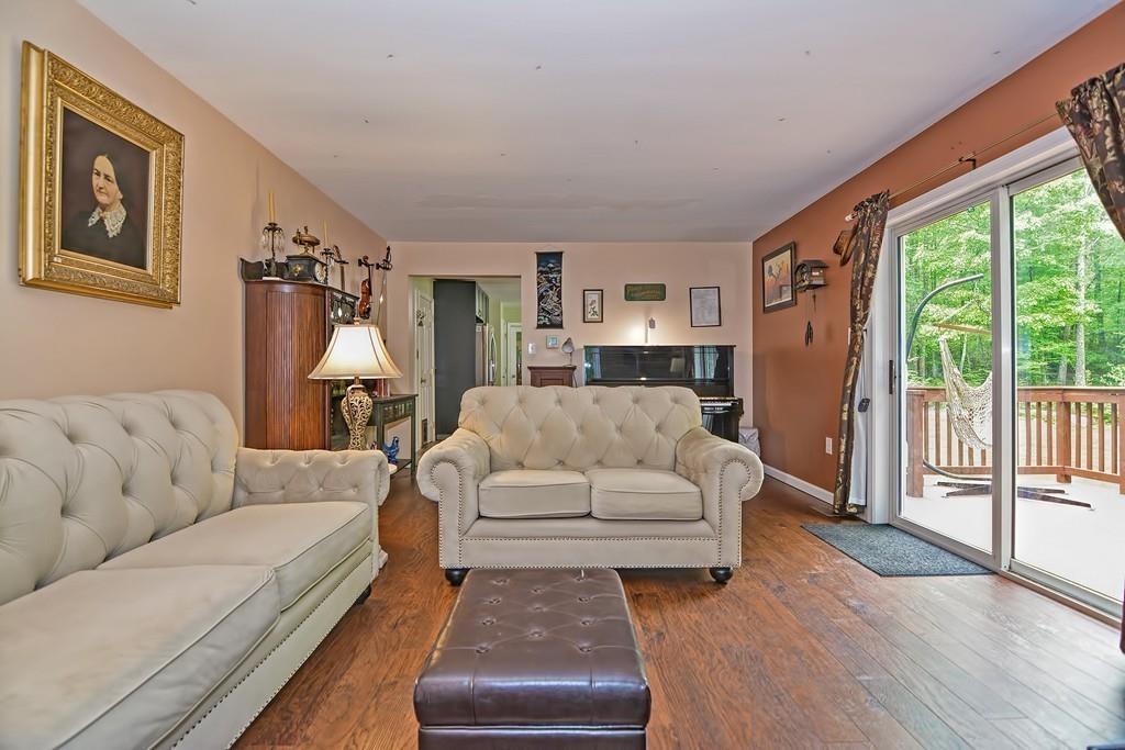 173 Webster Street Douglas, MA 01516 - Photo 13 of 42 a living room with furniture and a large window