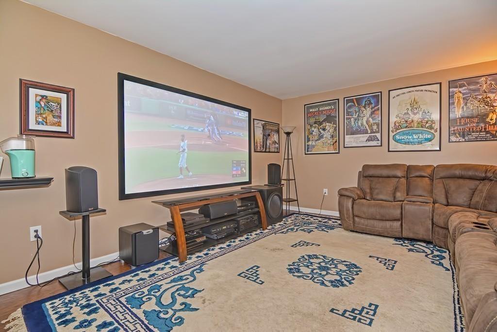 173 Webster Street Douglas, MA 01516 - Photo 17 of 42 a living room with furniture and a flat screen tv