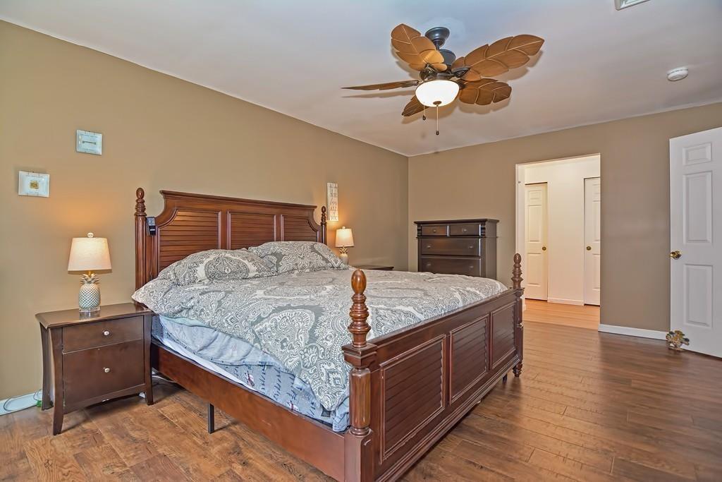 173 Webster Street Douglas, MA 01516 - Photo 21 of 42 a bedroom with a bed and wooden floor