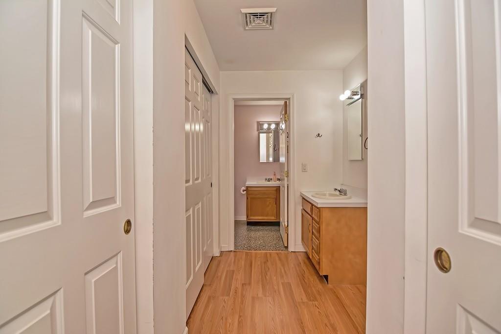 173 Webster Street Douglas, MA 01516 - Photo 24 of 42 a view of a hallway with wooden floor and bathroom