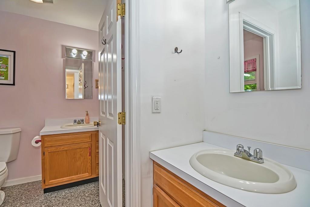 173 Webster Street Douglas, MA 01516 - Photo 25 of 42 a bathroom with a sink and a mirror