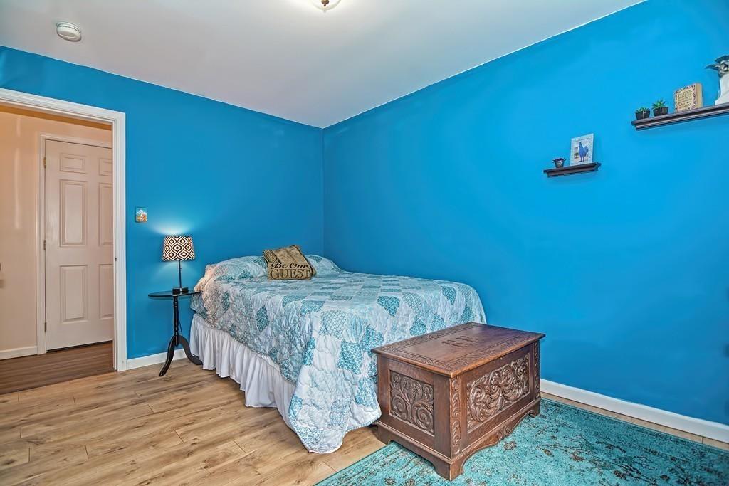 173 Webster Street Douglas, MA 01516 - Photo 26 of 42 a bed sitting in a spacious bedroom next to a window
