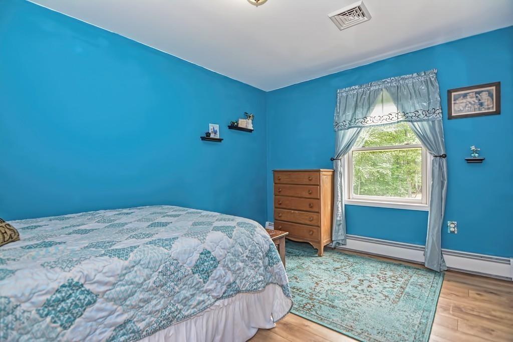 173 Webster Street Douglas, MA 01516 - Photo 27 of 42 a bedroom with a bed and a window