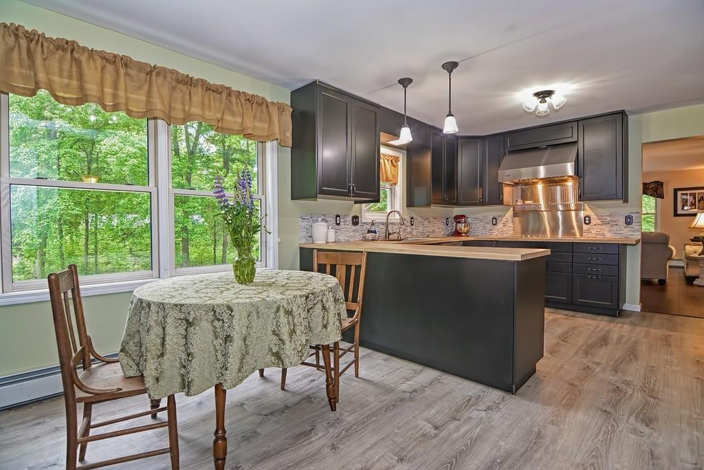 173 Webster Street Douglas, MA 01516 - Photo 3 of 42 a view of a dining room with furniture window and wooden floor