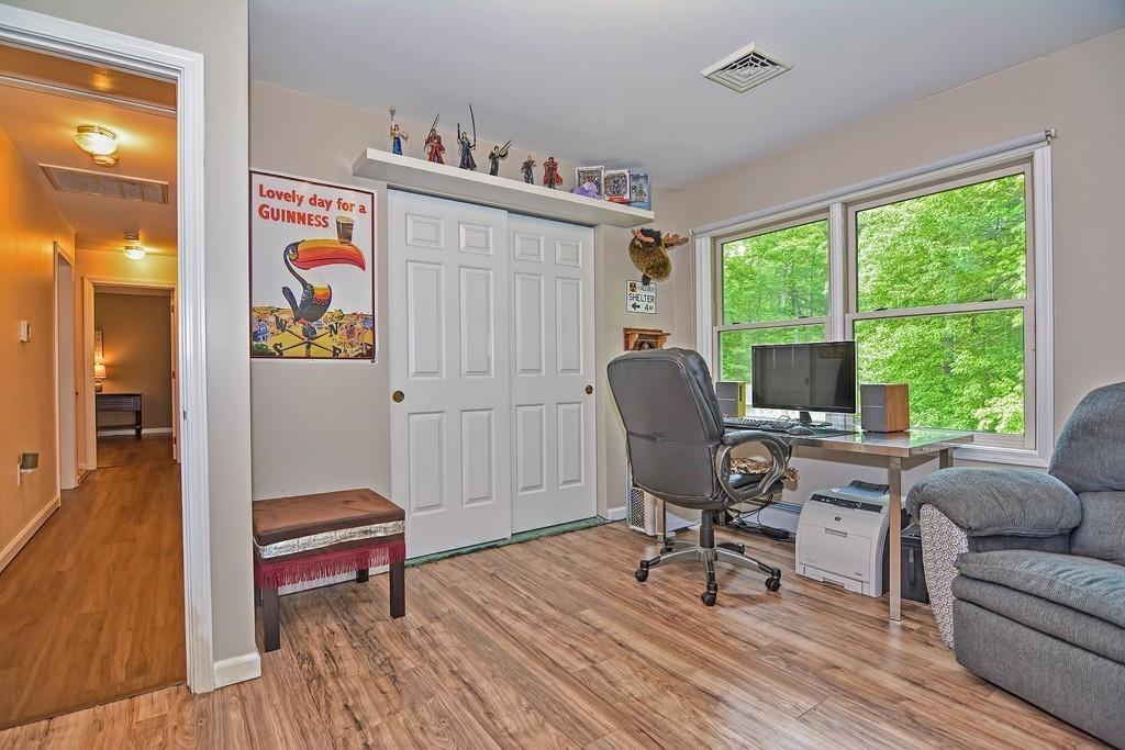173 Webster Street Douglas, MA 01516 - Photo 31 of 42 a living room with furniture a rug and a floor to ceiling window
