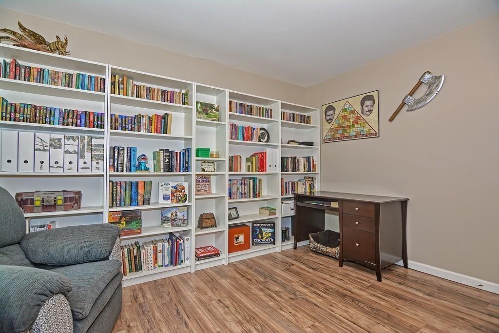 173 Webster Street Douglas, MA 01516 - Photo 33 of 42 a living room with a couch and a book shelf