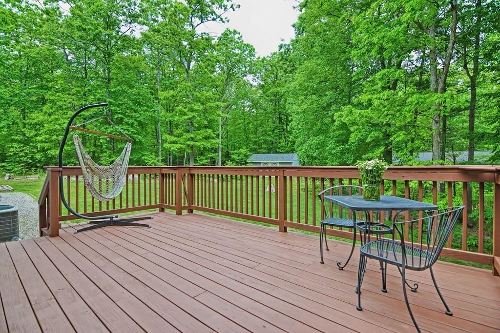 173 Webster Street Douglas, MA 01516 - Photo 36 of 42 a view of a wooden deck with a bench