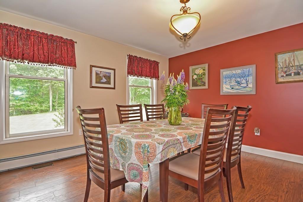 173 Webster Street Douglas, MA 01516 - Photo 9 of 42 a view of a dining room with furniture window and wooden floor