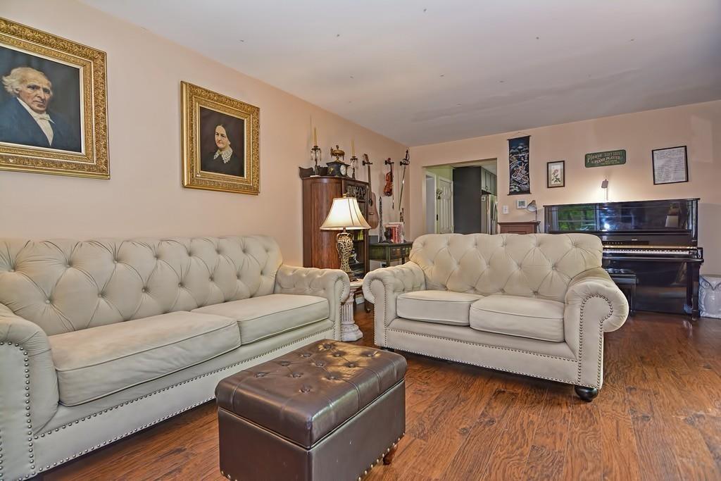 173 Webster Street Douglas, MA 01516 - Photo 10 of 42 a living room with furniture and a wooden floor