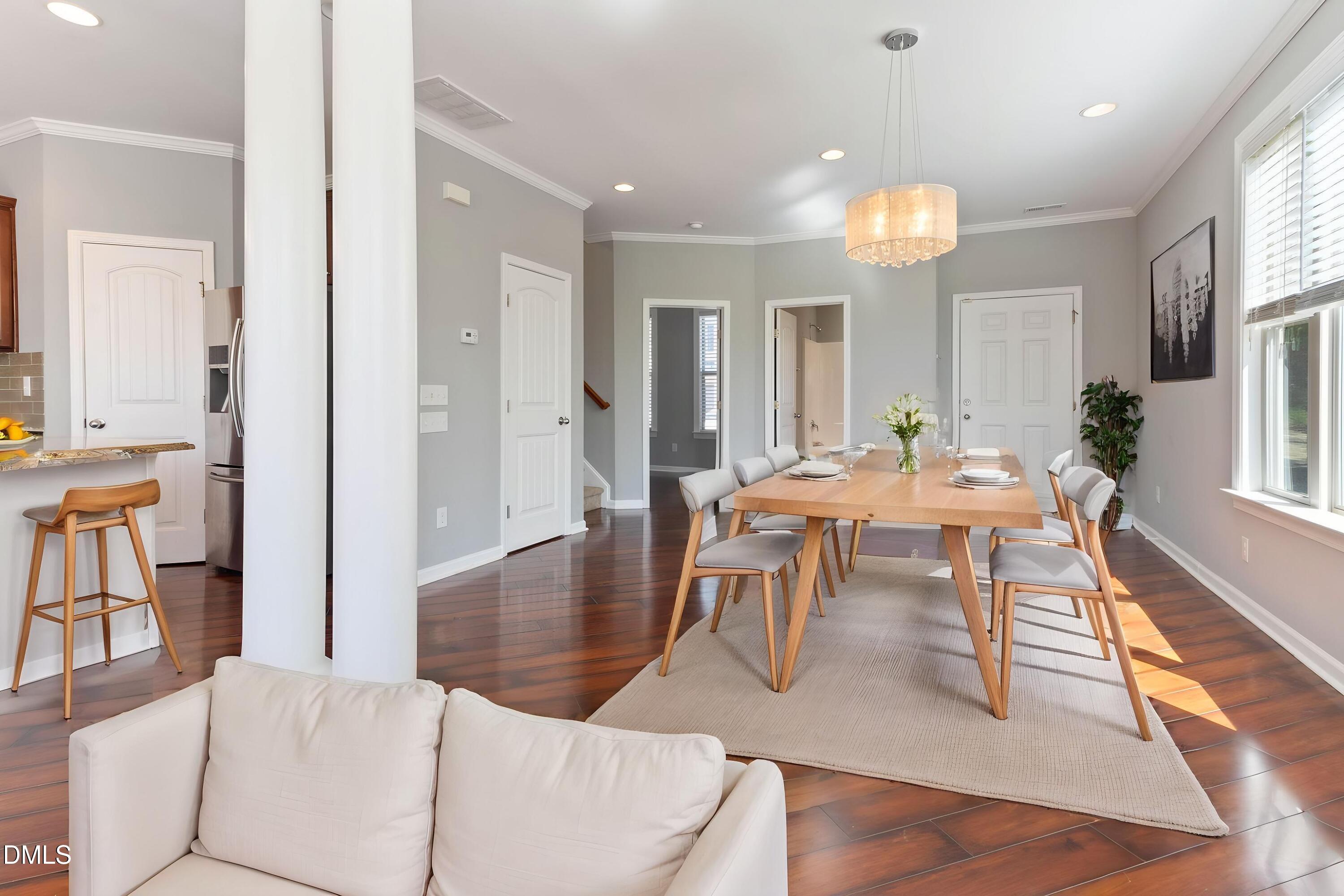 14303 Foxcroft Road Raleigh, NC 27614 - Photo 17 of 70 an open kitchen with dining table and chairs