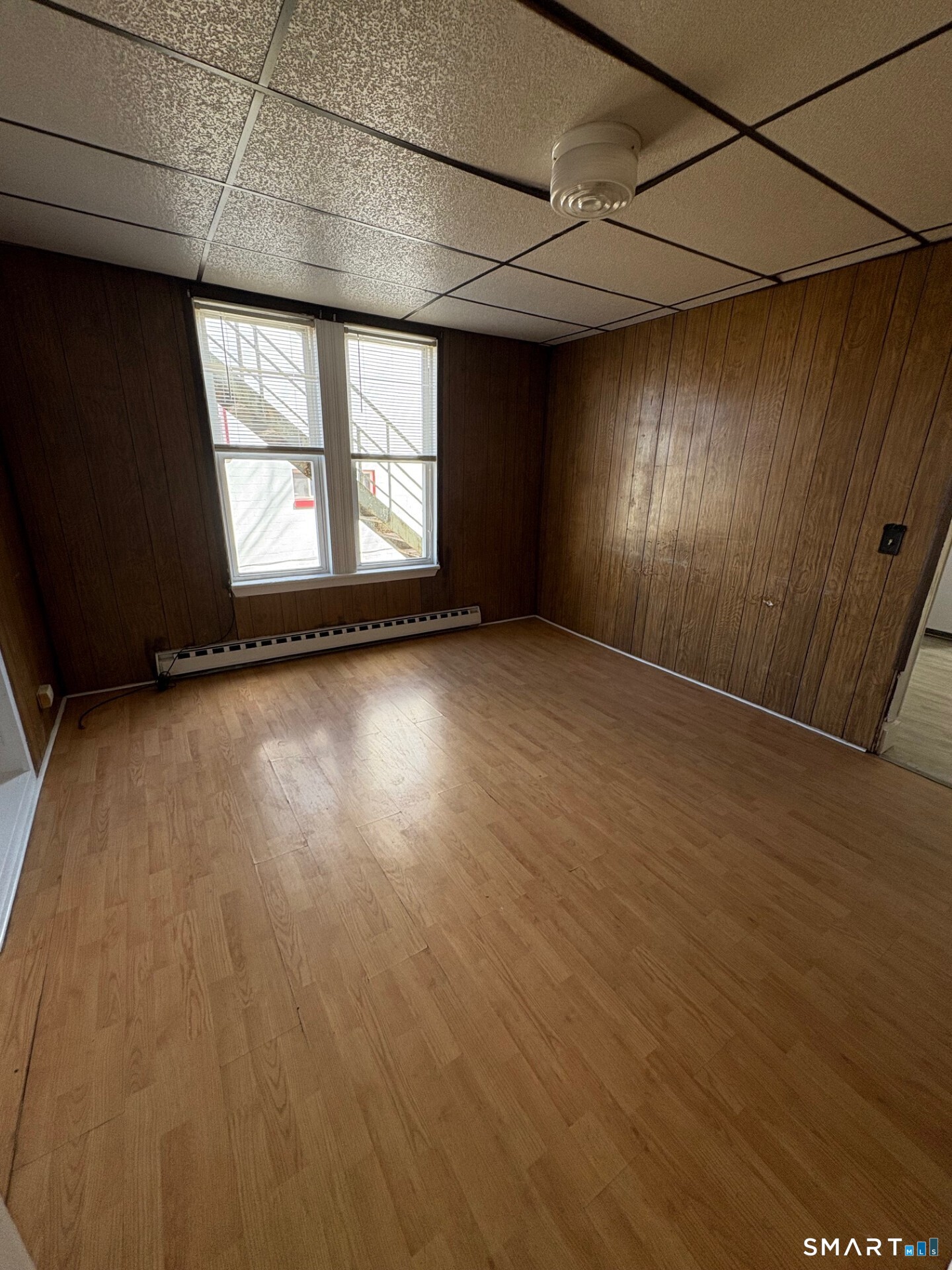 55 Beaver Brook Road, Unit 2 Danbury, CT 06810 - Photo 8 of 9 an empty room with wooden floor and windows