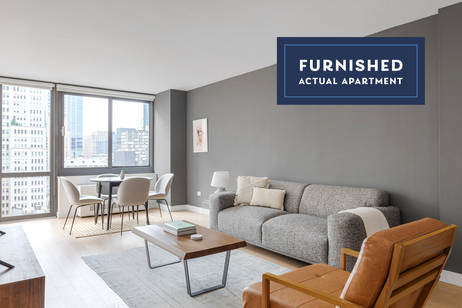 a living room with furniture and a floor to ceiling window