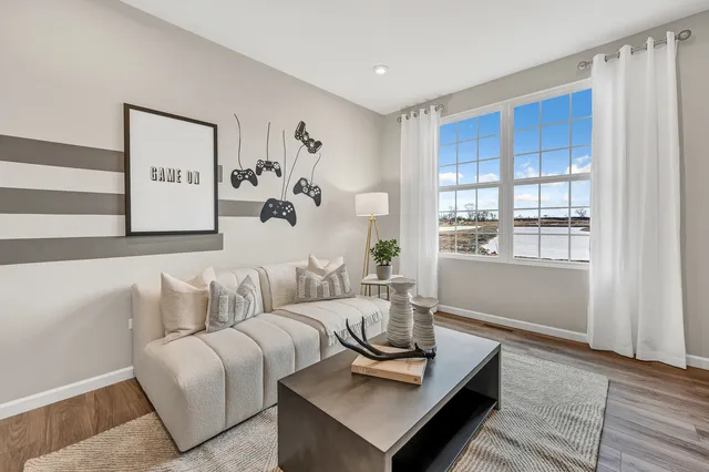 a living room with furniture and window