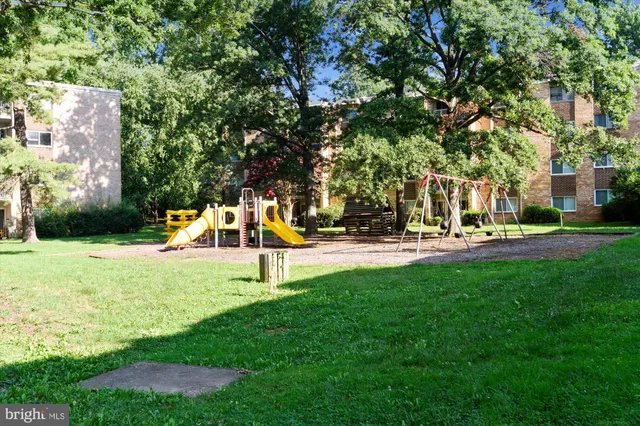 a front view of a building with seating space