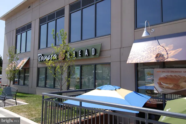 a view of a yard with snow on the road
