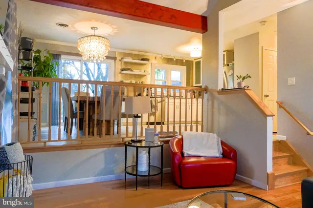 a view of a living room and entryway