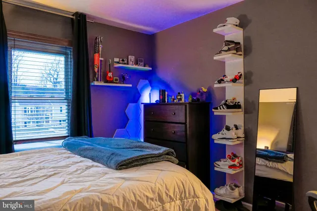 a bedroom with a bed and a closet