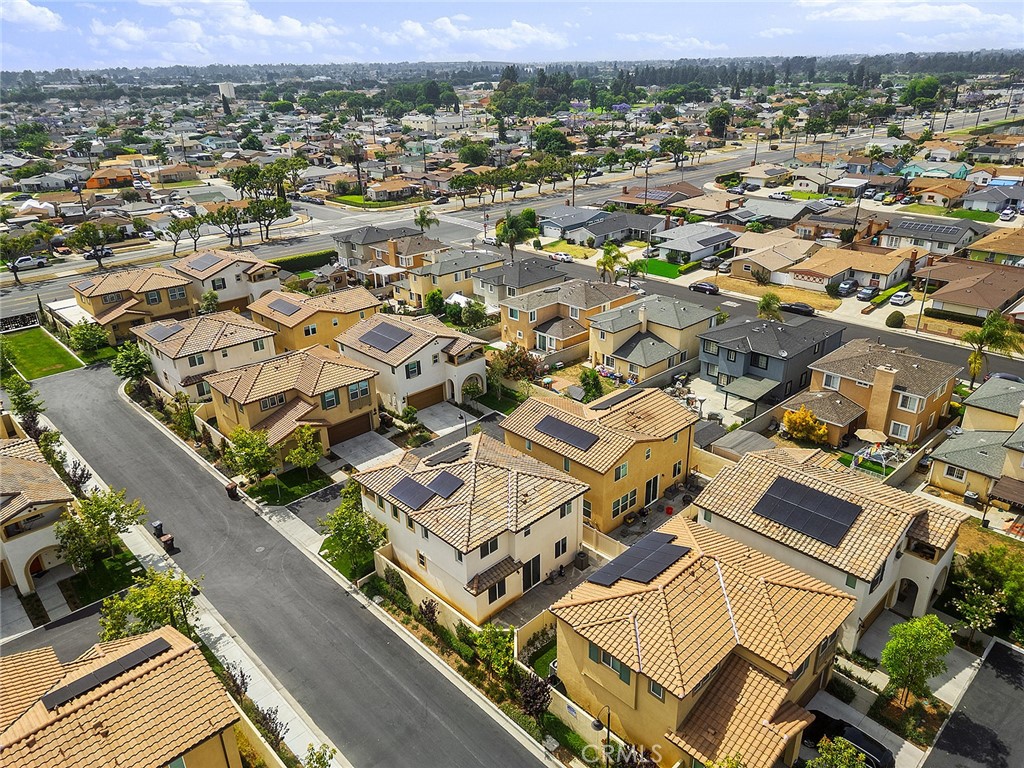 an aerial view of residential building with parking