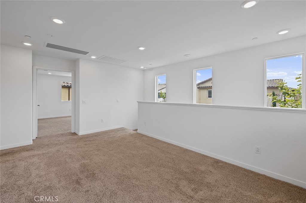 1942 North Florish Drive Compton, CA 90222 - Photo 25 of 47 an empty room with a window and wooden floor
