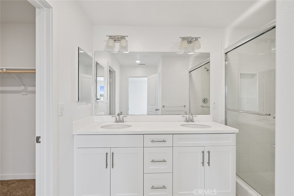1942 North Florish Drive Compton, CA 90222 - Photo 29 of 47 a bathroom with a sink vanity and mirror