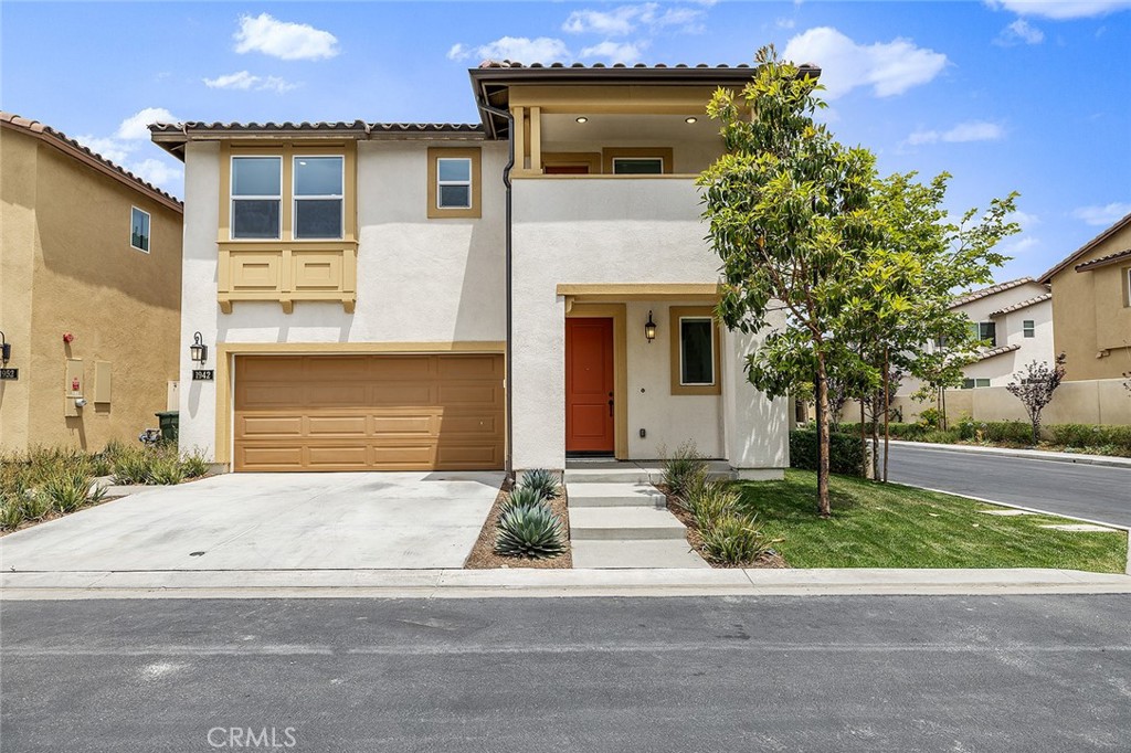 1942 North Florish Drive Compton, CA 90222 - Photo 41 of 47 a front view of a house with a yard and garage
