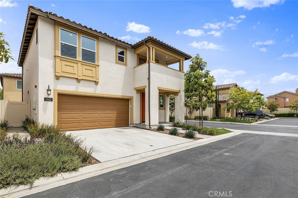 1942 North Florish Drive Compton, CA 90222 - Photo 43 of 47 a front view of a house with a yard and garage