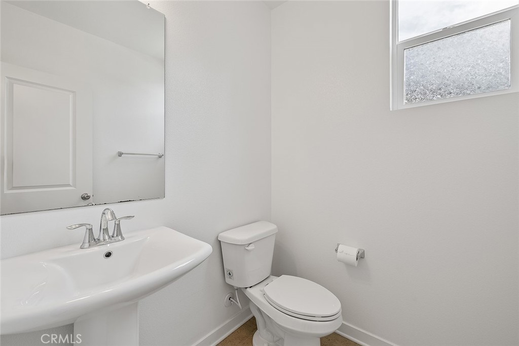 1942 North Florish Drive Compton, CA 90222 - Photo 10 of 47 a white toilet sitting next to a bathroom sink