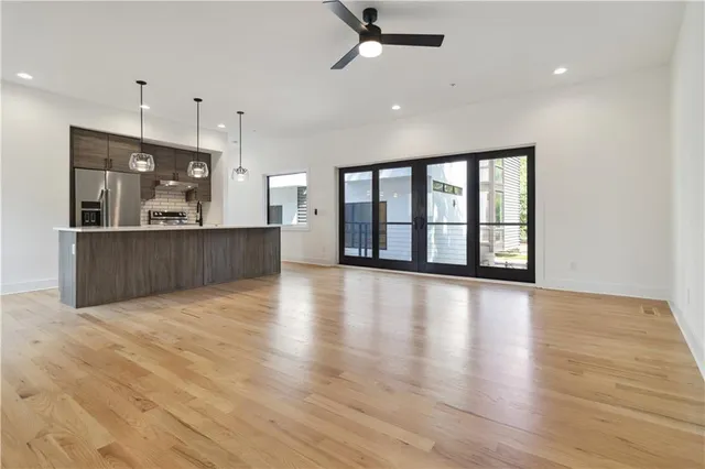 a view of kitchen with wooden floor and window