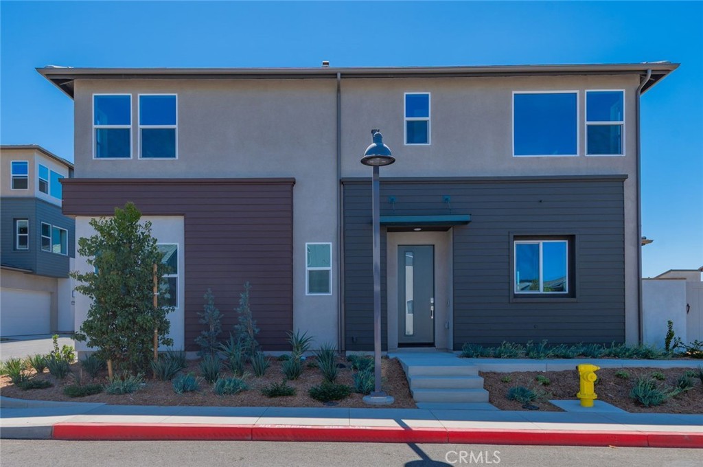 a front view of building with yard