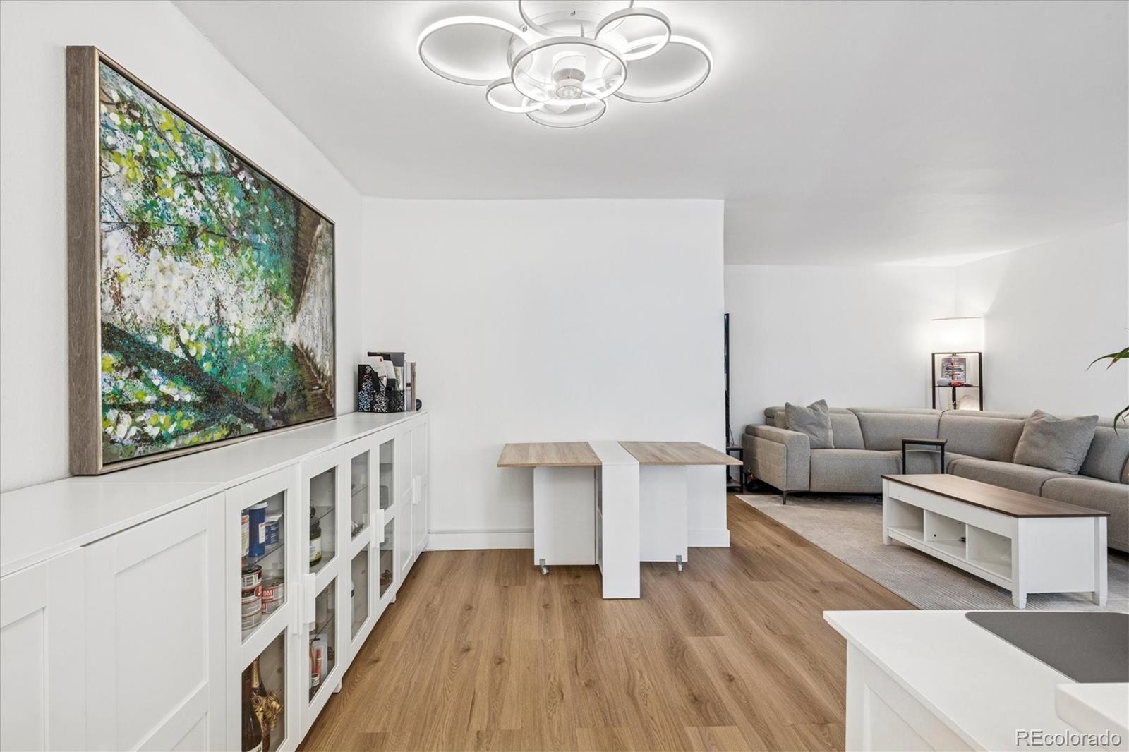 2 Adams Street, Unit 510 Denver, CO 80206 - Photo 13 of 37 a living room with furniture and a large window