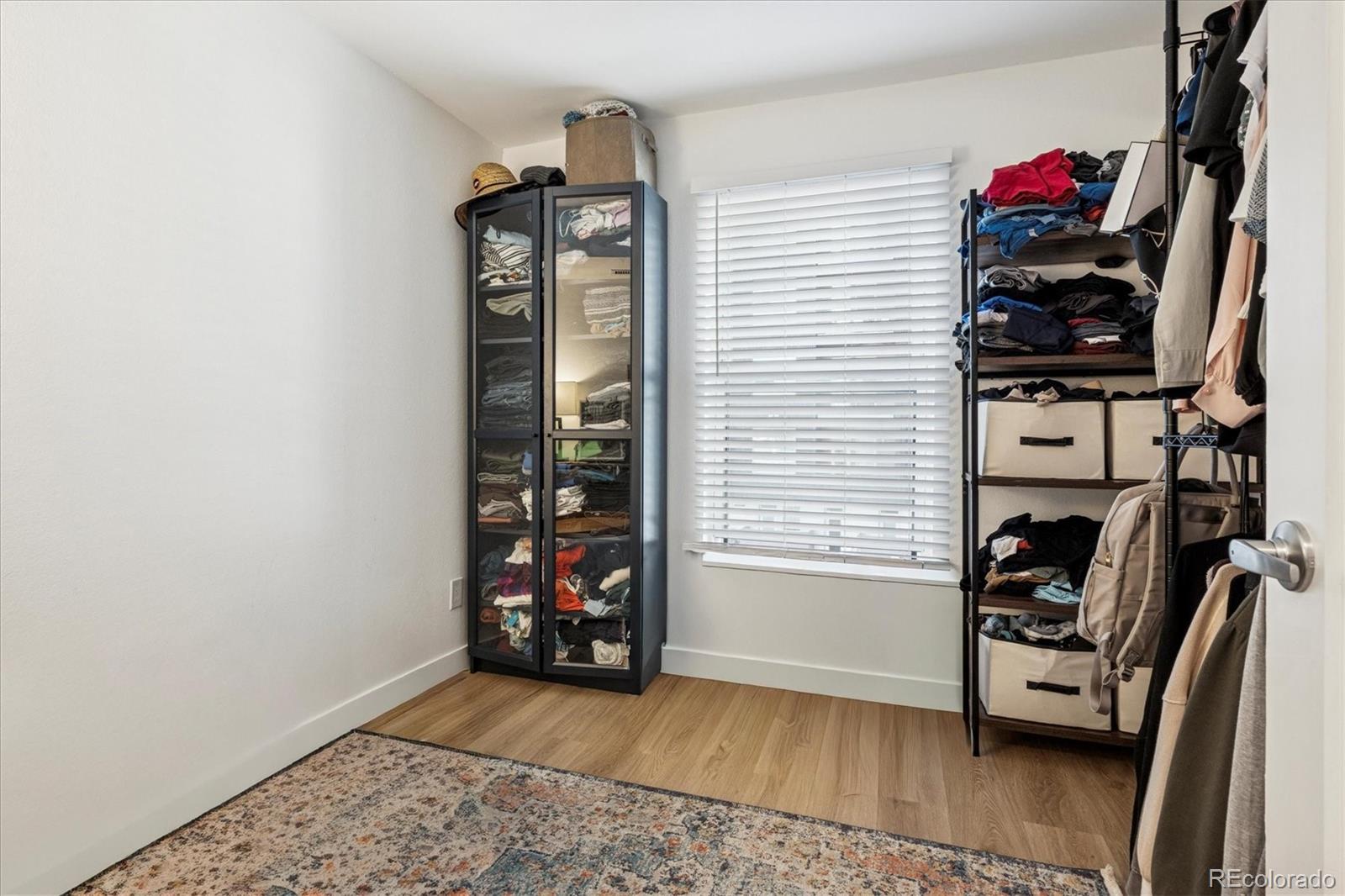 2 Adams Street, Unit 510 Denver, CO 80206 - Photo 18 of 37 a view of a storage & utility room with closet window