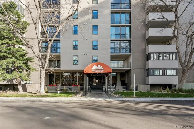 a building with trees in front of it