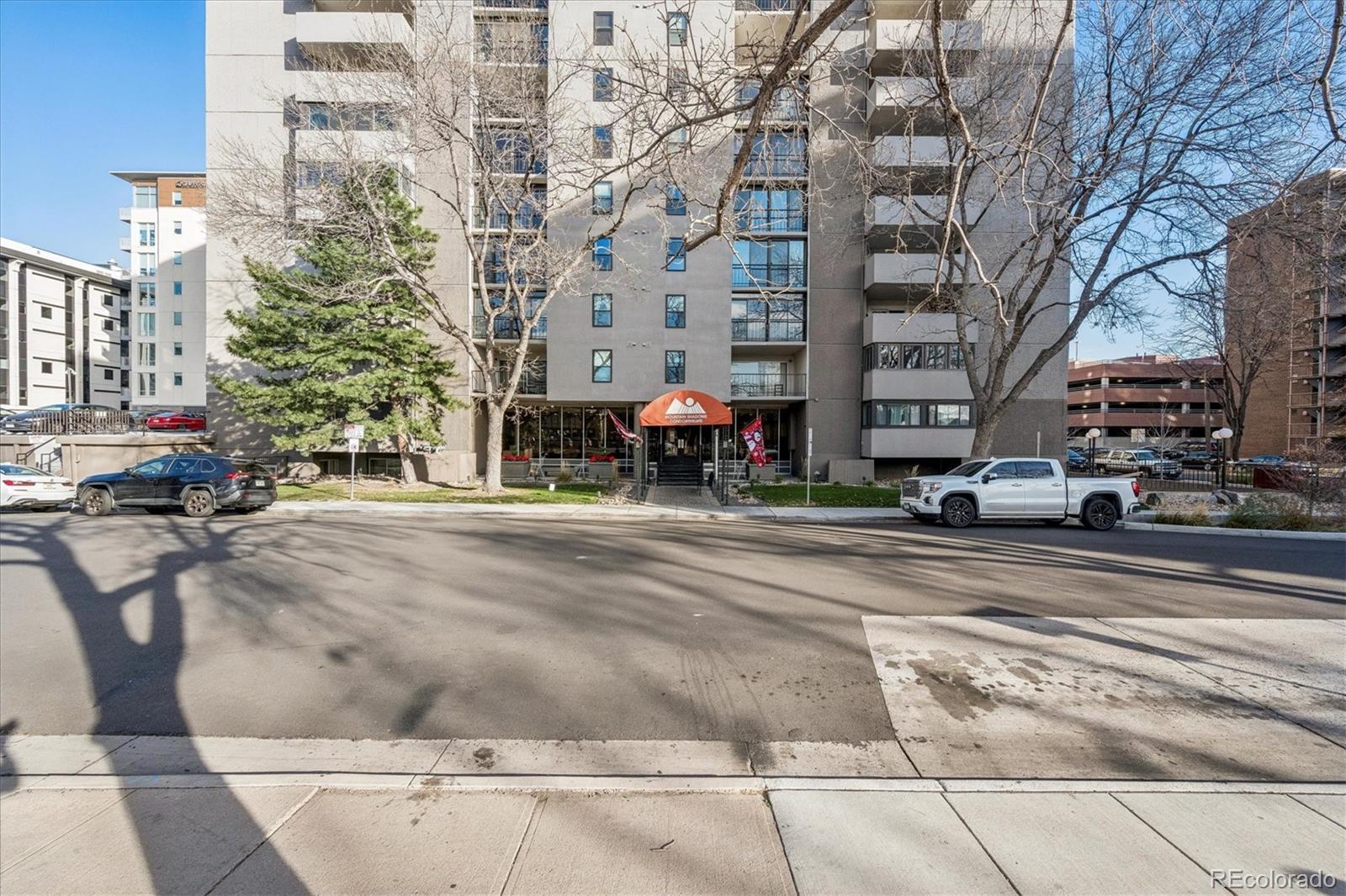 2 Adams Street, Unit 510 Denver, CO 80206 - Photo 26 of 37 a building with trees in front of it