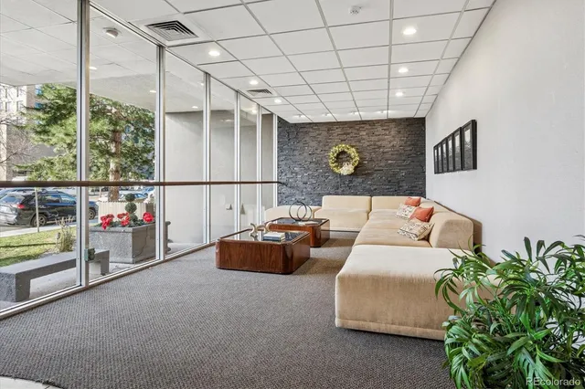 a living room with furniture and a rug