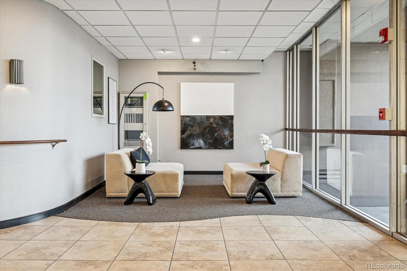 2 Adams Street, Unit 510 Denver, CO 80206 - Photo 31 of 37 a living room with furniture and a rug