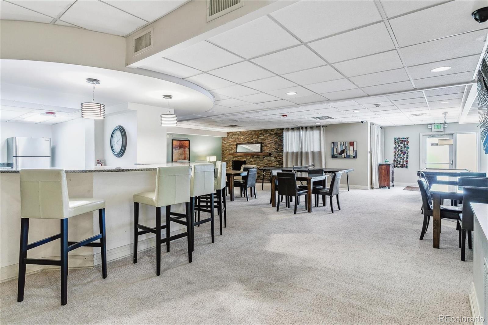 2 Adams Street, Unit 510 Denver, CO 80206 - Photo 35 of 37 a group of chairs sitting in kitchen and kitchen