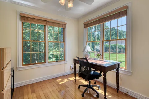 a view of a dining room with furniture window and outside view