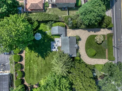 an aerial view of a house with a garden