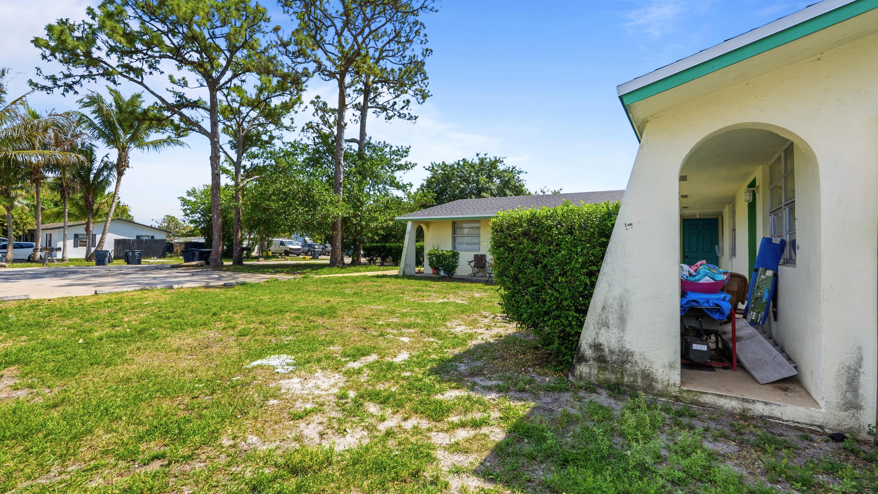 4453 Stevens Road Lake Worth Beach, FL 33461 - Photo 29 of 67 a view of a house with garden and trees