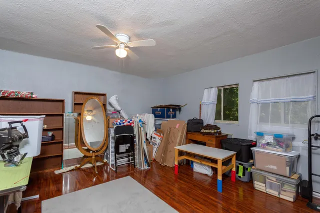 a living room with furniture a rug and a window